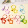Wholesale Colorful five-pointed star acrylic keychain pendant dopamine earphone case ornaments small fresh couple bag decoration