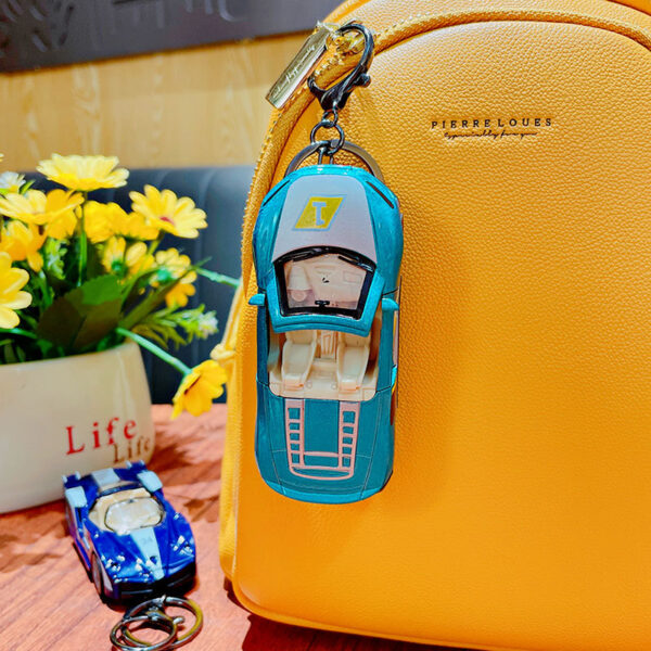 oly-9af526c305fcbb5f34d801f7fc6ef0ad Wholesale Alloy back sports car key chain pendant graffiti simulation racing model student schoolbag pendant small gift