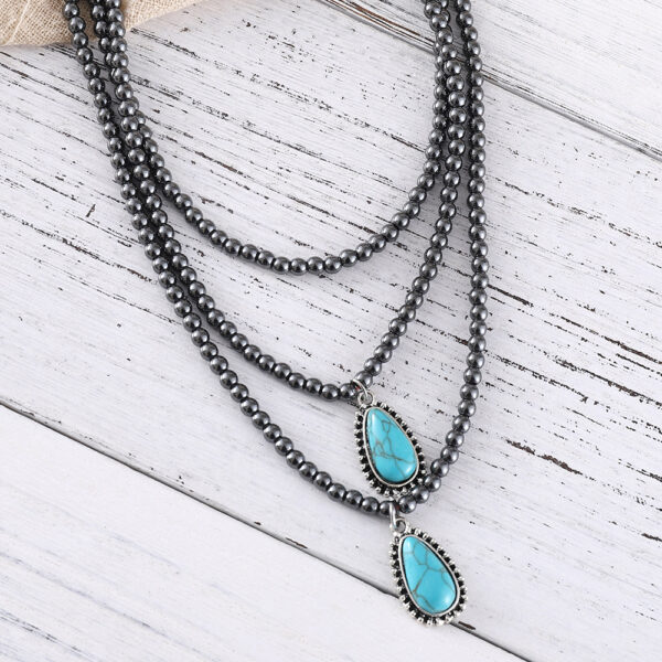 Wholesale European and American cross-border Bohemian ethnic style three-layer teardrop-shaped turquoise black bead necklace, popular jewelry