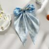 Wholesale Summer beach hair clip with starfish and seashell print, long ribbon bow, spring clip, stylish hair accessory for women.