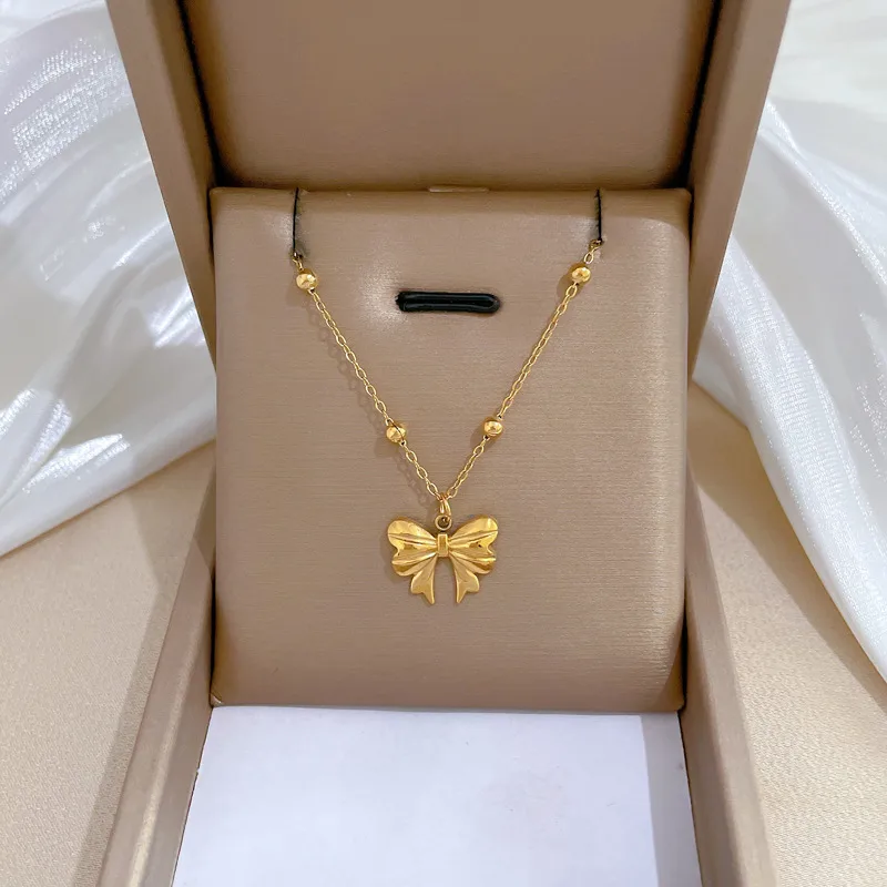 Wholesale PVD Coated Real Gold Plated Bow Knot Titanium Steel Sweet Simple Style Waterproof Non Tarnish Titanium Steel Pendant Necklace
