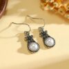 oly-9cf6399a7f1554067bc8f9fee72df98c Wholesale Vintage sier-plated flower earrings inlaid with pearls