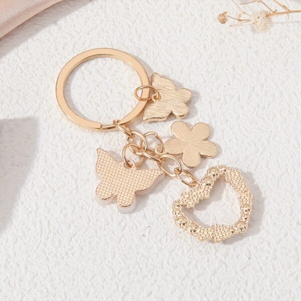 oly-9ea2b7c9e6f32323e1d78bfa25a802a1 Wholesale butterfly flower alloy key chain pendant love diamond cute small white flower pendant key chain aessories