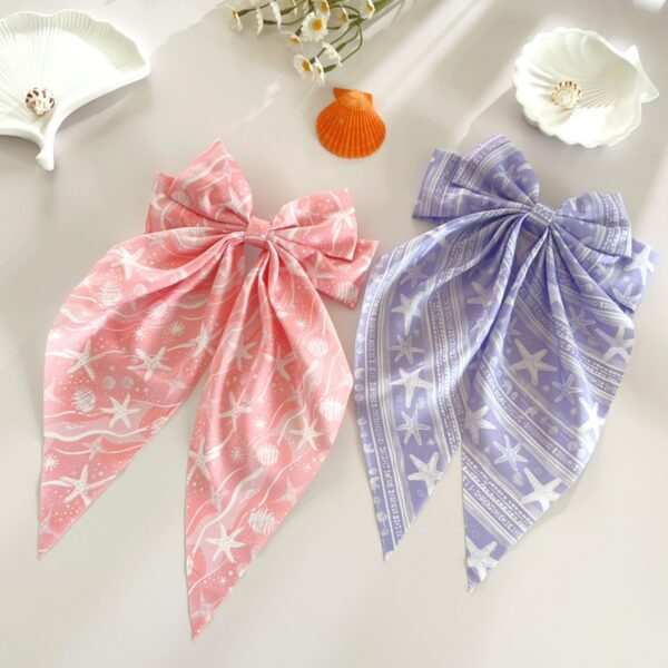 Wholesale Summer beach hair clip with starfish and seashell print, long ribbon bow, spring clip, stylish hair accessory for women.
