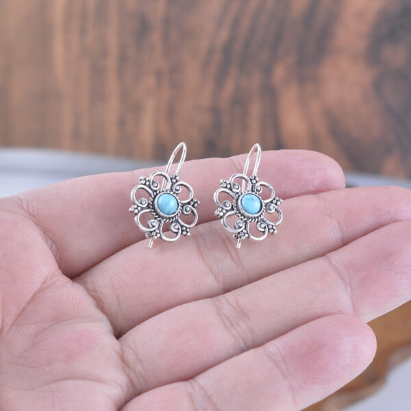 Wholesale Hollow petal inlaid turquoise drop earrings