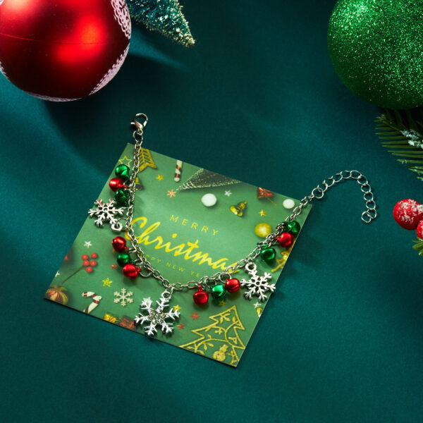 Wholesale New European and American cross-border Christmas jewelry set for women, featuring colorful bells, rhinestone-encrusted snowflakes, and pendants.