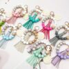 oly-a1e8a7ed5a60bc86f1f7a0d53f9f196f Wholesale Silicone Beads Tassel Wood Beads Wrist Keychain
