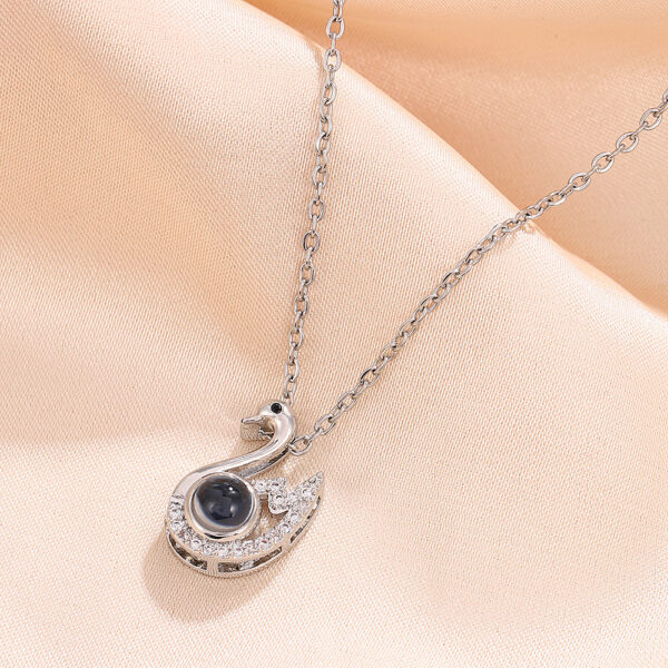 Wholesale Amazon Light Luxury Swan Necklace Design Sense Hundred Languages Projection Necklace European and American Elegant O-Word Titanium Steel Necklace