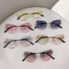 oly-a5e50aac661da2c97048a5ad0d833fc3 Wholesale Cross-border in stock new frameless trim sunglasses fashion cat's eye gradient sunglasses Europe and the United States retro Internet red explosions