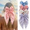 Wholesale Summer beach hair clip with starfish and seashell print, long ribbon bow, spring clip, stylish hair accessory for women.