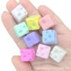 oly-a7556f686070faff4057e6bf76a414e3 Wholesale Creamy solid colored cheese square straight hole bead