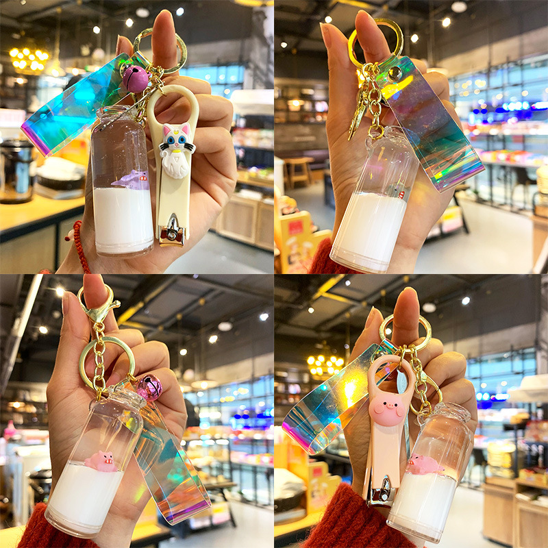 Wholesale Creative Internet red floating pig milk pig keychain cartoon quicksand oil ift bottle car bag pendant
