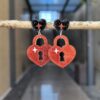 oly-a784c4db0a371afc201f72beef35b9ee Wholesale Valentine's Day sequined heart acrylic pendant earrings for women