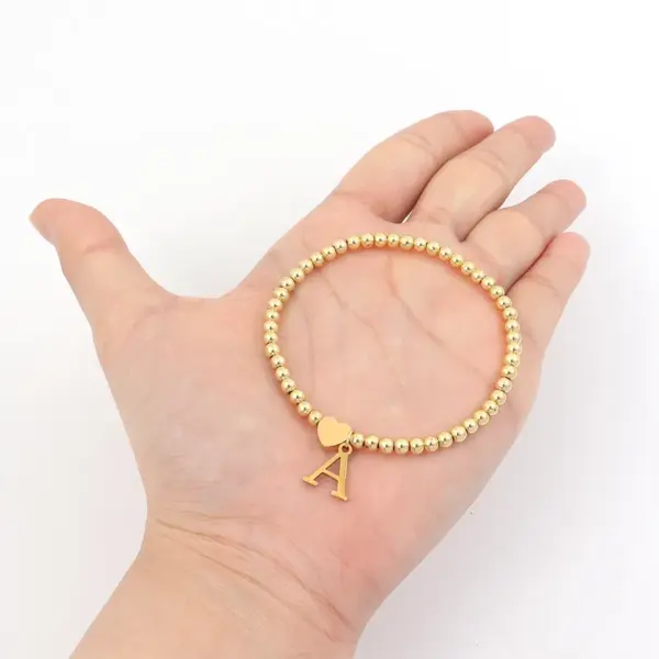 oly-a795d4a4a166a3c47d6c944d40d6249b Wholesale PVD Coated Real Gold Plated Letter 201 Stainless Steel 304 Simple Style Classic Waterproof Non Tarnish Bracelets