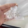 Wholesale Christmas element zircon pearl exaggerated snowflake earrings