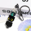 oly-a8cf335c01920d6885553ba02ac57c15 Wholesale Flocked Cartoon Big-Eyed Cat Head Beaded DIY Phone Chain/Keychain Aessories