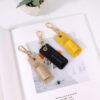 oly-a9b0e7d29c68897963230c23bae33c5a Wholesale Neck Pencil Bag Portable Small Leather Pen Clip Key Pendant