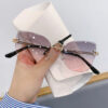 oly-ab23c2625bc35b4e1e703c8c98da4d94 Wholesale Cross-border in stock new frameless trim sunglasses fashion cat's eye gradient sunglasses Europe and the United States retro Internet red explosions
