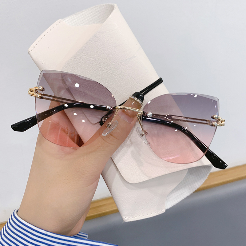 Wholesale Cross-border in stock new frameless trim sunglasses fashion cat's eye gradient sunglasses Europe and the United States retro Internet red ex