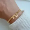Wholesale PVD Coated Real Gold Plated Letter Bow Knot 201 Stainless Steel 304 Stainless Steel Elegant Simple Style Classic Style Waterproof Non Tarnish 201 Stainless Steel Bracelets
