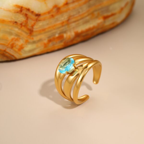 Wholesale Openwork irregular blue zircon stainless steel ring with gold plating