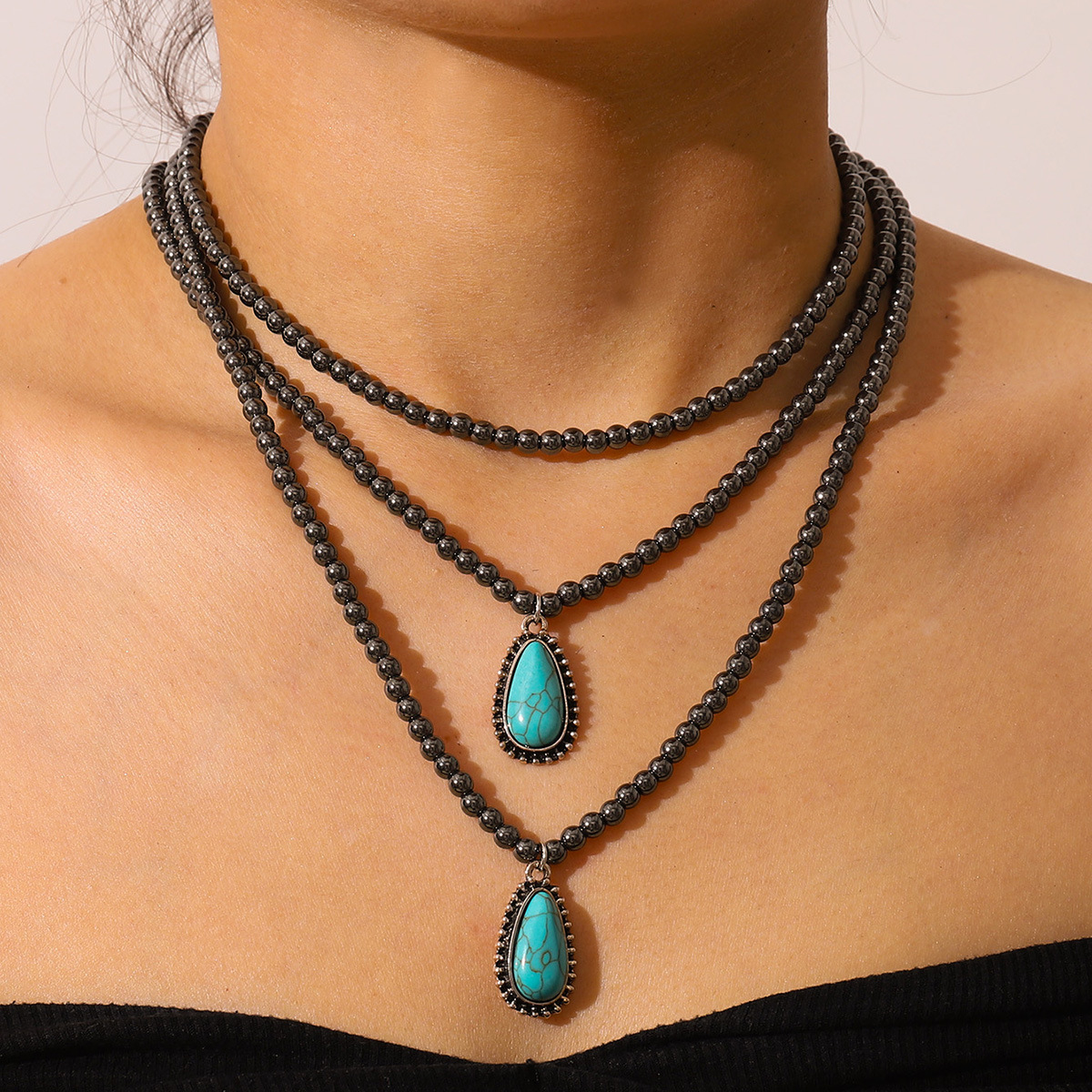 Wholesale European and American cross-border Bohemian ethnic style three-layer tearop-shaped turquoise black bead necklace, pular jewelry
