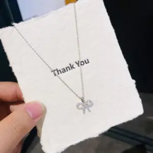 Silver Bow Necklace with Zircon Inlay
