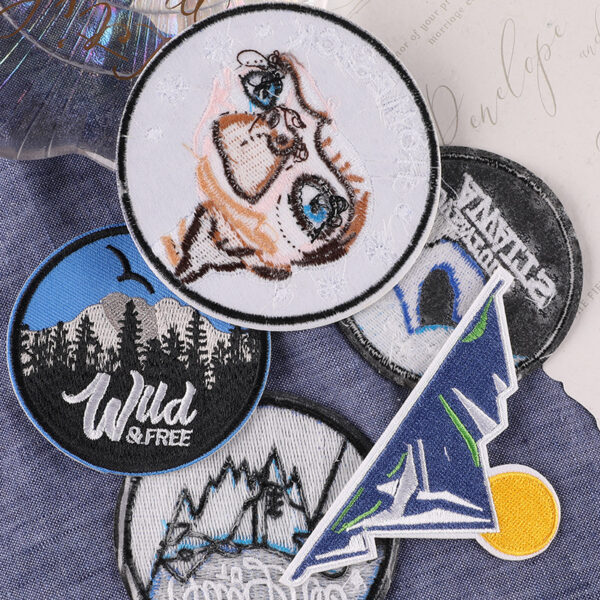 oly-af70bffc05cf60e4ec7b9456f0822fb8 Wholesale Computer embroidery logo round iceberg forest badge logo clothing aessories badge cloth label adhesive patch embroidery cloth sticker