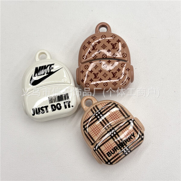 Wholesale Cartoon print beaded backpack with hanging holes