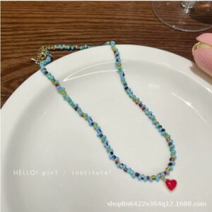 Blue beaded red heart necklace
