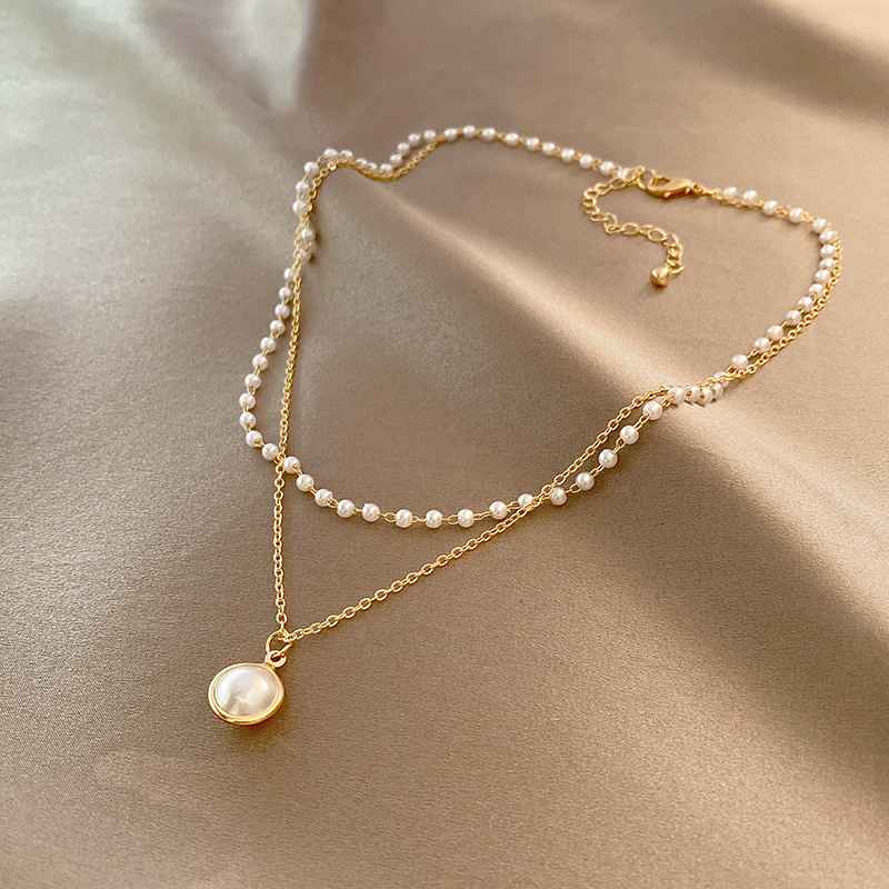 Wholesale European and American fashion double-layer Pearl clavicle chain temperament retro cold wind pendant design personality versatile necklace wo