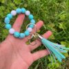 oly-b7cf15598397c097aad74bec52399459 Wholesale Colorful beaded heart-shaped printed tassel bracelet/keychain
