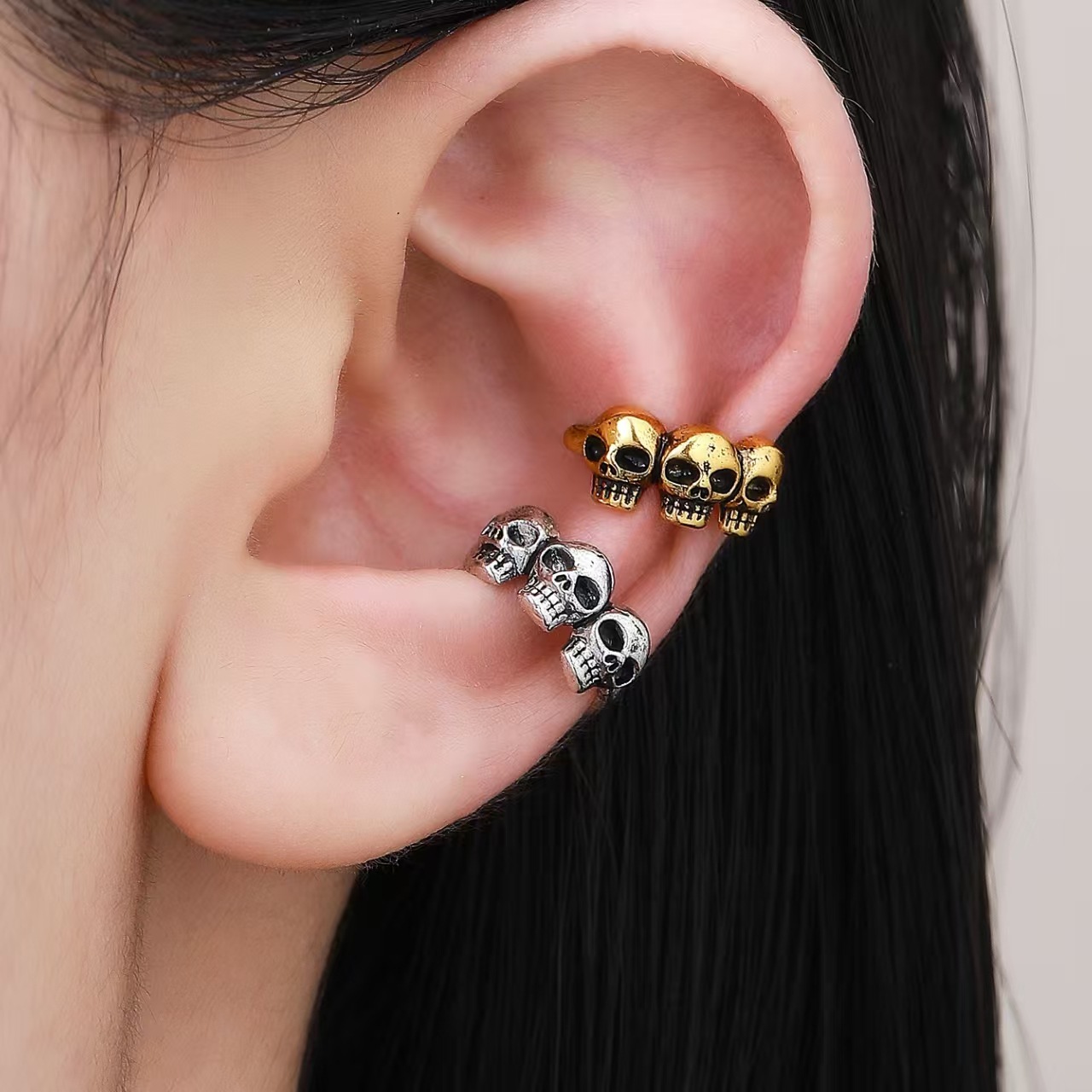 Wholesale Three skull ghost claw ear cus