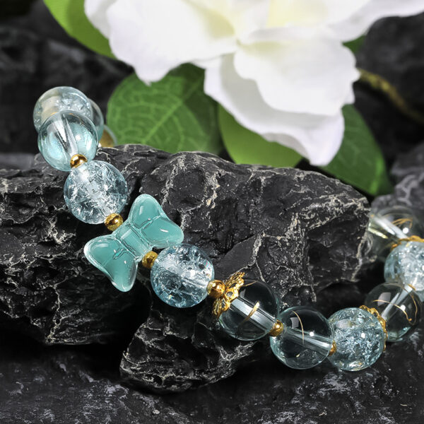 oly-b9561c83062cf3f973b606a016abd30b Wholesale Colored glass bow bead