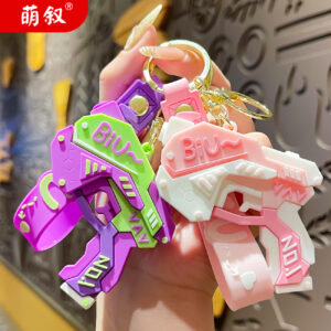 Wholesale Cool pistol cartoon keychain creative doll couple bag pendant exquisite car key chain ornaments