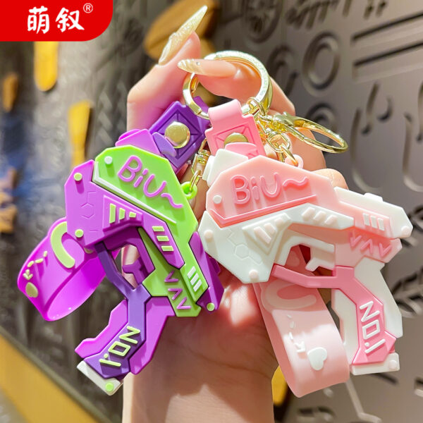 Wholesale Cool pistol cartoon keychain creative doll couple bag pendant exquisite car key chain ornaments