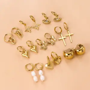 Wholesale 1 Pair Fashion Cross Devil'S Eye Heart Shape Butterfly Gold Plated 304 Stainless Steel Artificial Pearls Rhinestones Stainless Steel Earrings