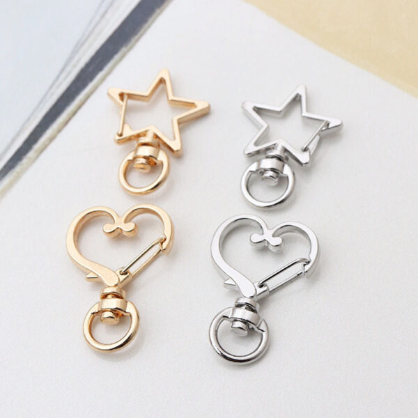 Wholesale Factory direct shaped keychain metal cat dolphin love five-pointed star cherry blossom shell jewelry accessories diy