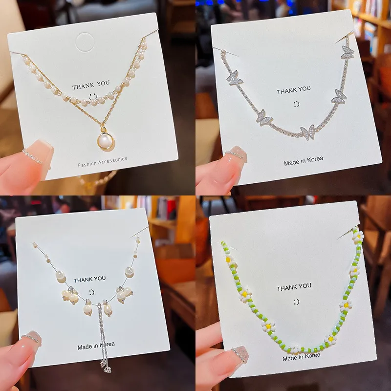 Wholesale Simple Style Tassel Flower Butterfly Stainless Steel Copper Beaded Artificial Pearls Zircon Necklace