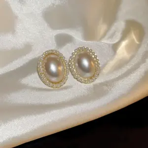 Silver Needle pearl white oval earrings