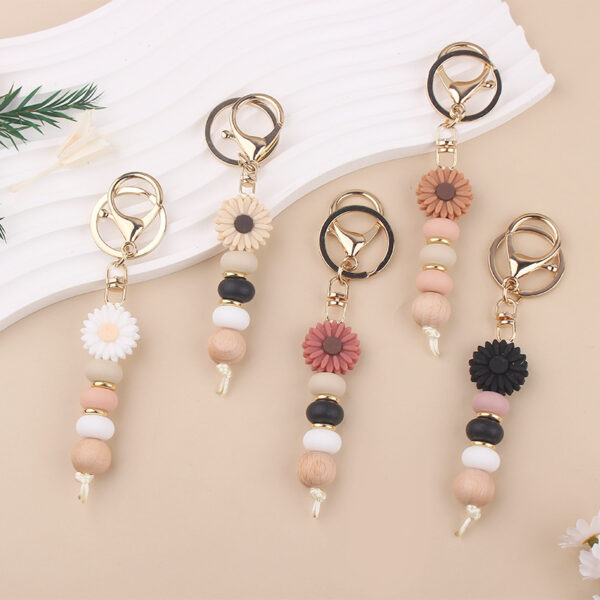 Wholesale New creative DIY cartoon daisy small tooth glue pendant handmade silicone beaded bag pendant keychain
