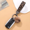 Wholesale Western cowboy style leopard print leather keychain bag charm plush pom-pom water bottle rope