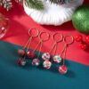 Wholesale Christmas-themed earrings with geometric pom-poms