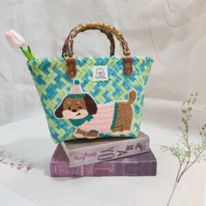 Green color bamboo handle basket with pink striped dog