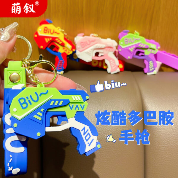 Wholesale Cool pistol cartoon keychain creative doll couple bag pendant exquisite car key chain ornaments