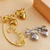 PVD Coated Real Gold Plated 18K Gold Heart Shape Bow Knot 304 Stainless Steel Elegant Glam Luxurious Waterproof Non Tarnish Dangling Earrings