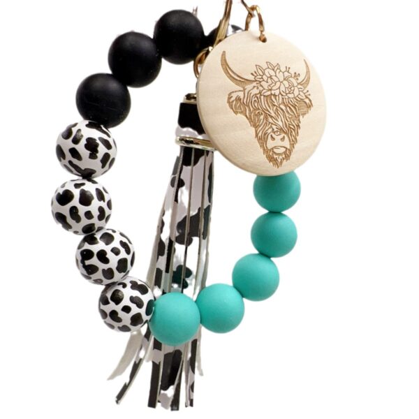 oly-c8ef6495715d93a5478d8036272b8785 Wholesale Western Style Dairy Wood Beads Silicone Beaded Round Wood Pieces Yak Keychain
