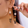 Wholesale New European and American style Halloween earrings, unique retro Halloween skull tassel stud earrings, in stock and available for wholesale.