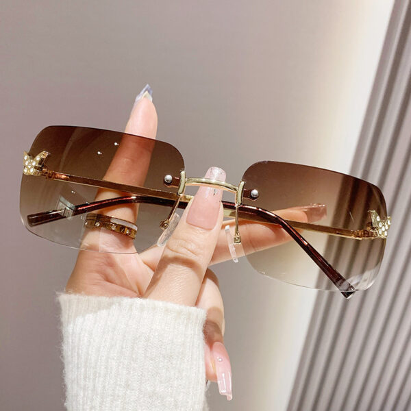 oly-c9d27cfe961fe863cb13523c5c75e24d Wholesale frameless sunglasses sunscreen glasses fashion high sense butterfly aessories diamond sunglasses ladies