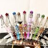 oly-cd70668d34607bc5e9f17eb39d048eee Wholesale DIY heavy industry beaded pen cross-border super fire hand-set diamond creative pen factory